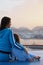 Woman and daughter sitting on deck of cruise ship