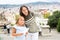 Woman with daughter at the street among architecture at Barcelona