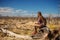 Woman in dead tree forest