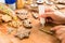 Woman decorated homemade christmas cookie.