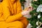 woman decorates the Christmas tree at her home. New year concept