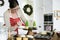 Woman decorating a cupcake hoilday