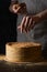 Woman decorating traditional napoleon cake