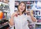 woman delighted with assortment of nail varnishes