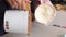 A woman demonstrates an ice cream mix. Makes homemade ice cream. Close-up