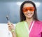 Woman dentist holding a dental polymerization lamp