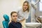 Woman dentist with a man patient, portrait in dental clinic