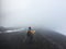 Woman descends the volcano slope