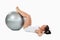 Woman developing her abs with a ball