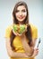 Woman diet concept portrait. Female model hold green salad.