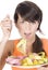 Woman diet eating a tape mesure