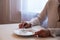 Woman on a diet, sitting in front of empty plate