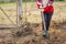 Woman digging with spade in garden