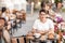 A woman dines in a street cafe