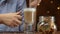 Woman dips cantucci coockies in latte coffee