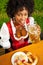 Woman in Dirndl drinking beer