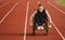 A woman with disablity driving a wheelchair on a track while preparing for the Paralympic Games