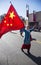 Woman displays Chinese flag at Chinese New Year parade, 2014, Year of the Horse, Los Angeles, California, USA