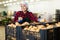 Woman distributes potatoes into boxes in a warehouse of vegetable factory