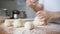 The woman divides the dough into equal pieces. Cooking pies. Hands close up. Female hands in the kitchen sculpt dough