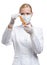 Woman doctor in mask hands vial