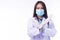 Woman doctor or nurse wear coat uniform and face mask hold arms over the chest signs stop pandemic epidemic while looking at