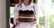 Woman doctor nutritionist holding chocolate delicious cake in her hands closeup 4k movie slow motion