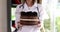 Woman doctor nutritionist holding chocolate delicious cake in her hands closeup 4k movie slow motion