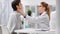 Woman doctor oncologist in uniform examining patient touching female neck and head medium close-up