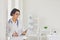 Woman doctor pediatrician standing in the white office of the hospital.