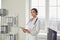 Woman doctor pediatrician standing in the white office of the hospital.