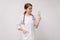 A woman doctor in a white coat holds cash from a patient. Payment to a nutritionist for work