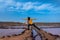 Woman does funny poses in the Salinas de Pozo Izquierdo. Aguimes. Gran Canaria. Las Palmas. Canary Islands. 1