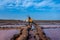 Woman does funny poses in the Salinas de Pozo Izquierdo. Aguimes. Gran Canaria. Las Palmas. Canary Islands. 2