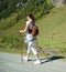 Woman does Nordic Walking