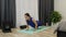 Woman does push-ups exercises at home. Young female athlete doing push-up exercises. Fitness instructor shows push-ups training. G
