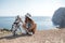 Woman with a dog dalmatian. Girl and her friend dog on the blue sea background