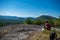 Woman and dog enjoying the view of Adirondack mountain range from the summit