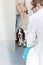 Woman with dog entering veterinary doctor\'s clinic