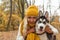 Woman and dog husky outdoor, face closeup