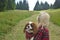 Woman and dog in royal stewart hiking