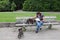 Woman with dogs on a bench