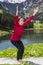 Woman doing chair pose outdoors