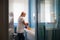 Woman doing chores and cleaning bathroom at home