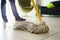 Woman Doing Chores Cleaning Floor At Home Focus on Mop