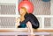 Woman doing exercise yoga and pilates pose on mat in gym. Asana. The concept of sport, fitness, training and health
