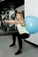 Woman doing exercises with balance ball in the gym. Balance ball improves stability and balance in women. Concept image of a