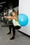 Woman doing exercises with balance ball in the gym. Balance ball improves stability and balance in women. Concept image of a