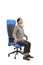 Woman doing exercises on the neck sitting in the chair at the office