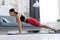 Woman doing a fitness at home in a living room. Training to become the best